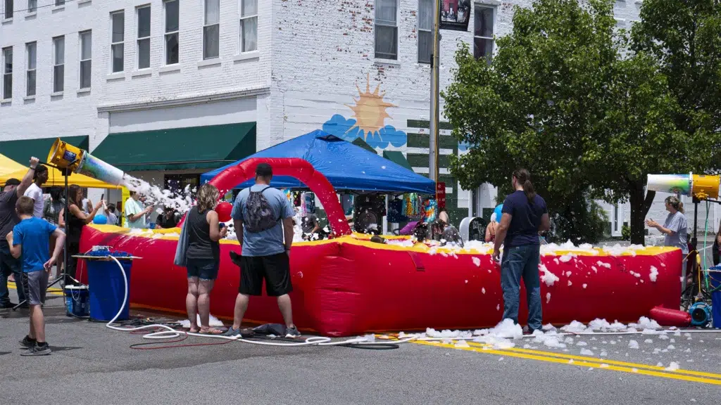 A float full of bubbles as a play area for children at the Celebrate Princeton street fair.