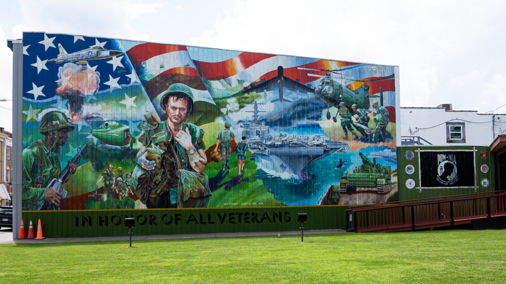 The veterans memorial wall mural in the Dick Copeland Town Square on Mercer Street.